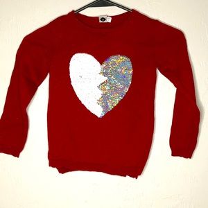 Girls red sweater with heart sequence